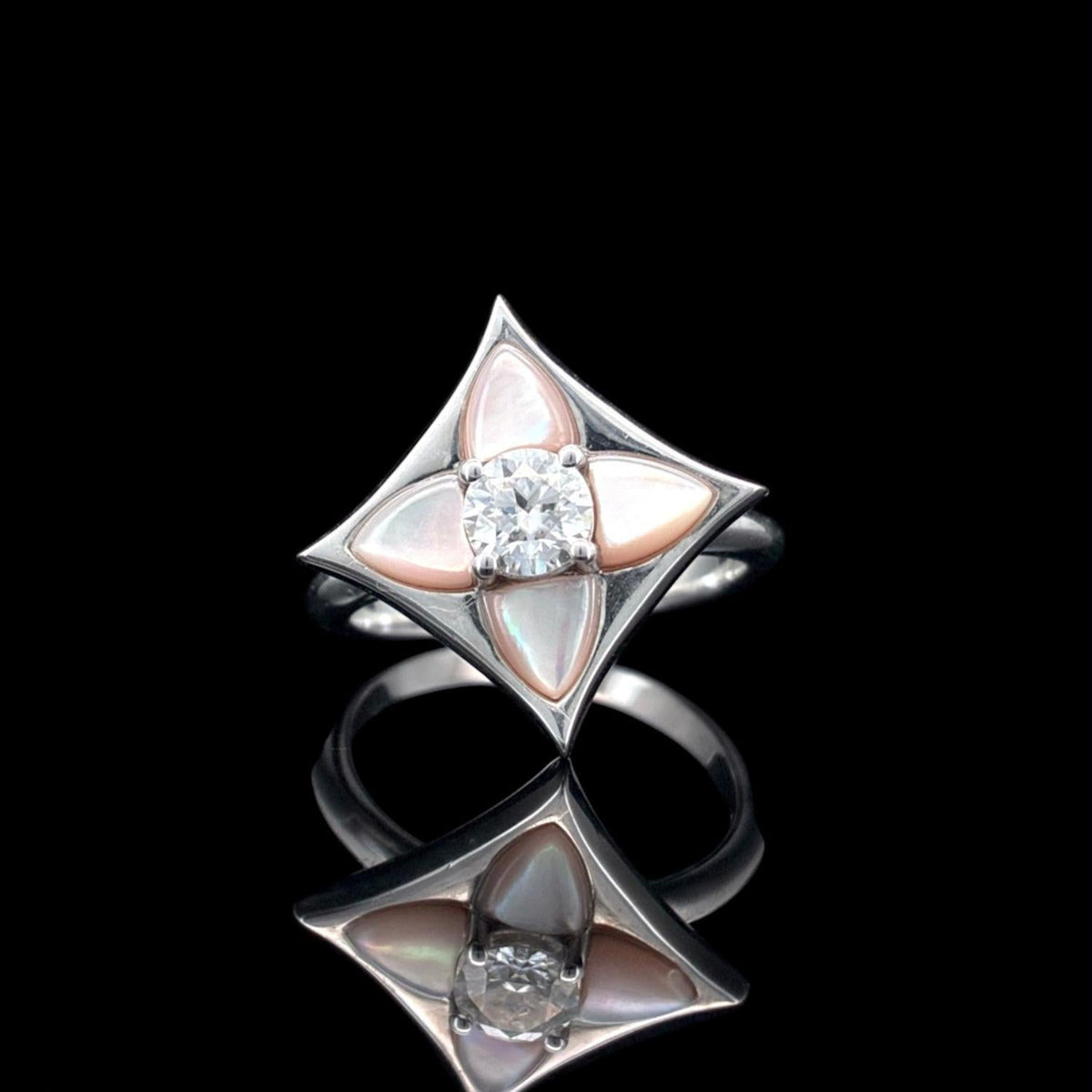 Impimo 0.50 CT moissanite and pink mother of pearl ring, 925 sterling silver with 18K white gold plating - the pointed shell and stone setting shown front on.
