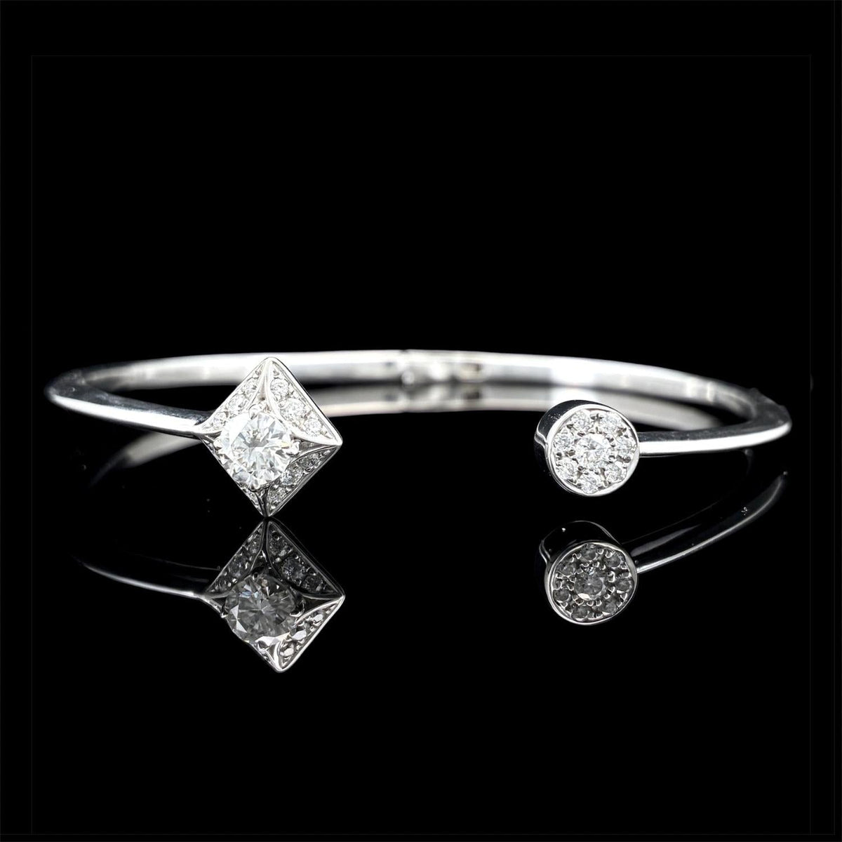 Impimo moissanite round centre bracelet, 925 sterling silver with 18K white gold plating - shown at an angle with the round centre stone and the moissanite-set band.