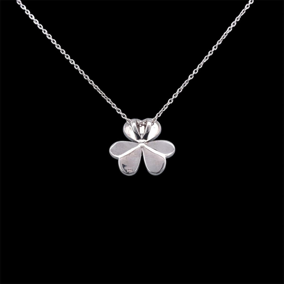 Impimo mother of pearl and moissanite flower pendant necklace - the hand-carved shell flower pendant with its raised round moissanite centre, on the chain.