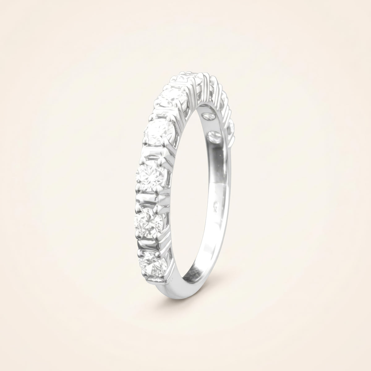 0.9 CT lab-grown diamond prong-set eternity band in 925 sterling silver with 18K white gold plating, on a light ivory background