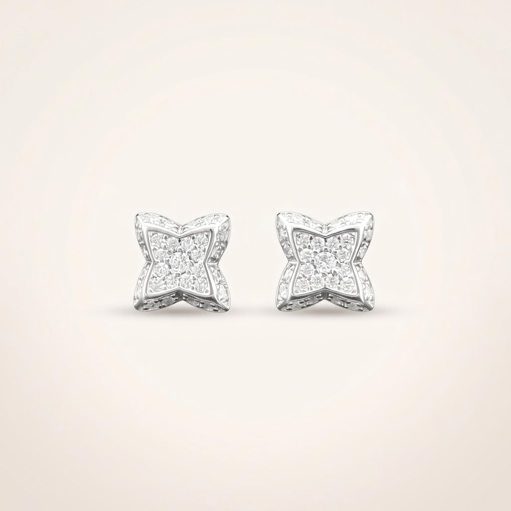 0.3 CT pair of moissanite round cut earrings in 925 sterling silver with 18K white gold plating, on a light ivory background