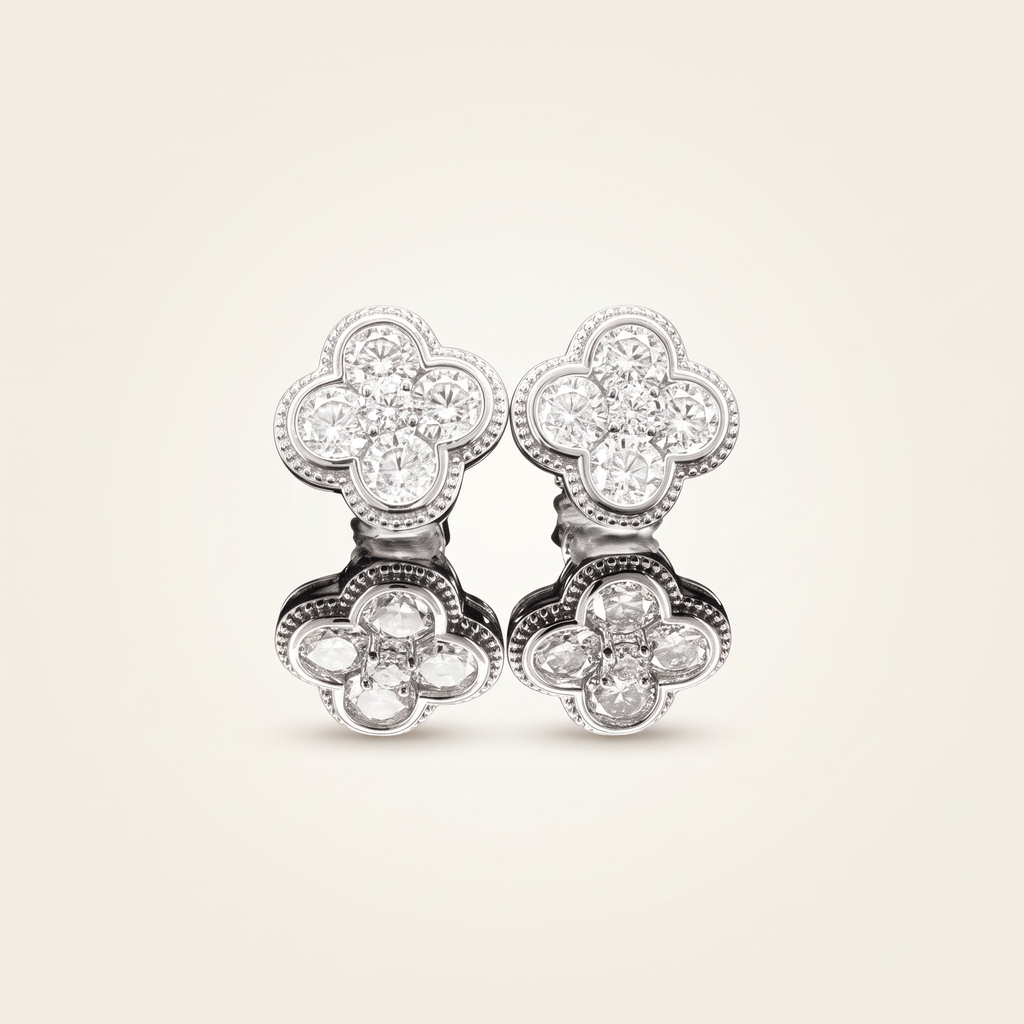 1.9 CT pair of moissanite round cut earrings in 925 sterling silver with 18K white gold plating, on a light ivory background