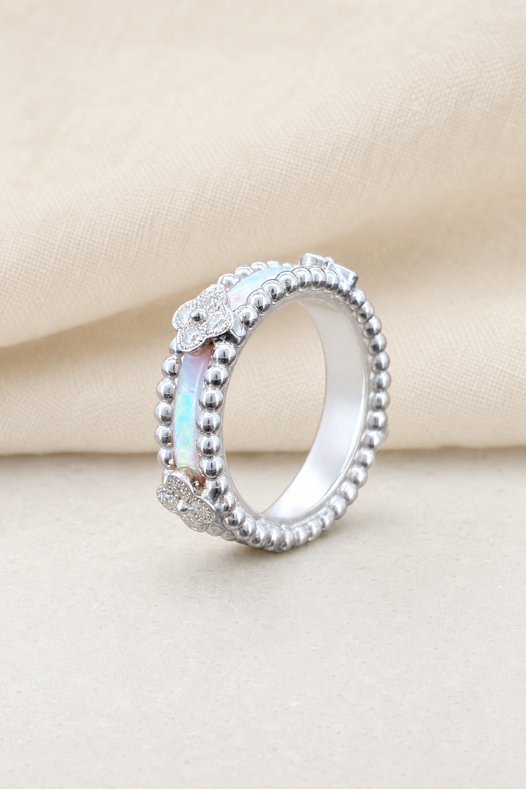 Impimo Natural Mother of Pearl & Moissanite Vintage Bead Band Ring - 925 Sterling Silver with 18K White Gold Plating | display view on ivory linen