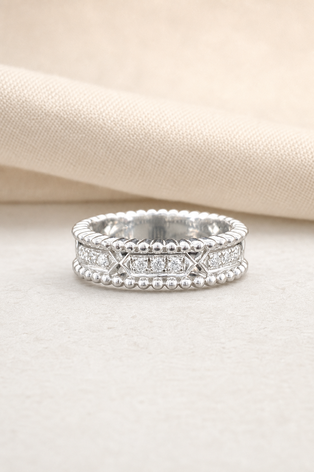 Impimo Moissanite Vintage Beaded Eternity Ring - 925 Sterling Silver 18K White Gold | display view on ivory linen