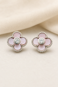Impimo Natural Pink Mother of Pearl & Moissanite Four-Leaf Clover Stud Earrings - 925 Sterling Silver with 18K White Gold Plating | display view on ivory linen