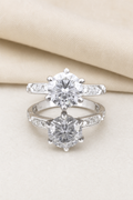 Impimo 1/2 CT Moissanite Round Cut Ring with Accent Stones - 925 Silver 18K White Gold | display view on ivory linen