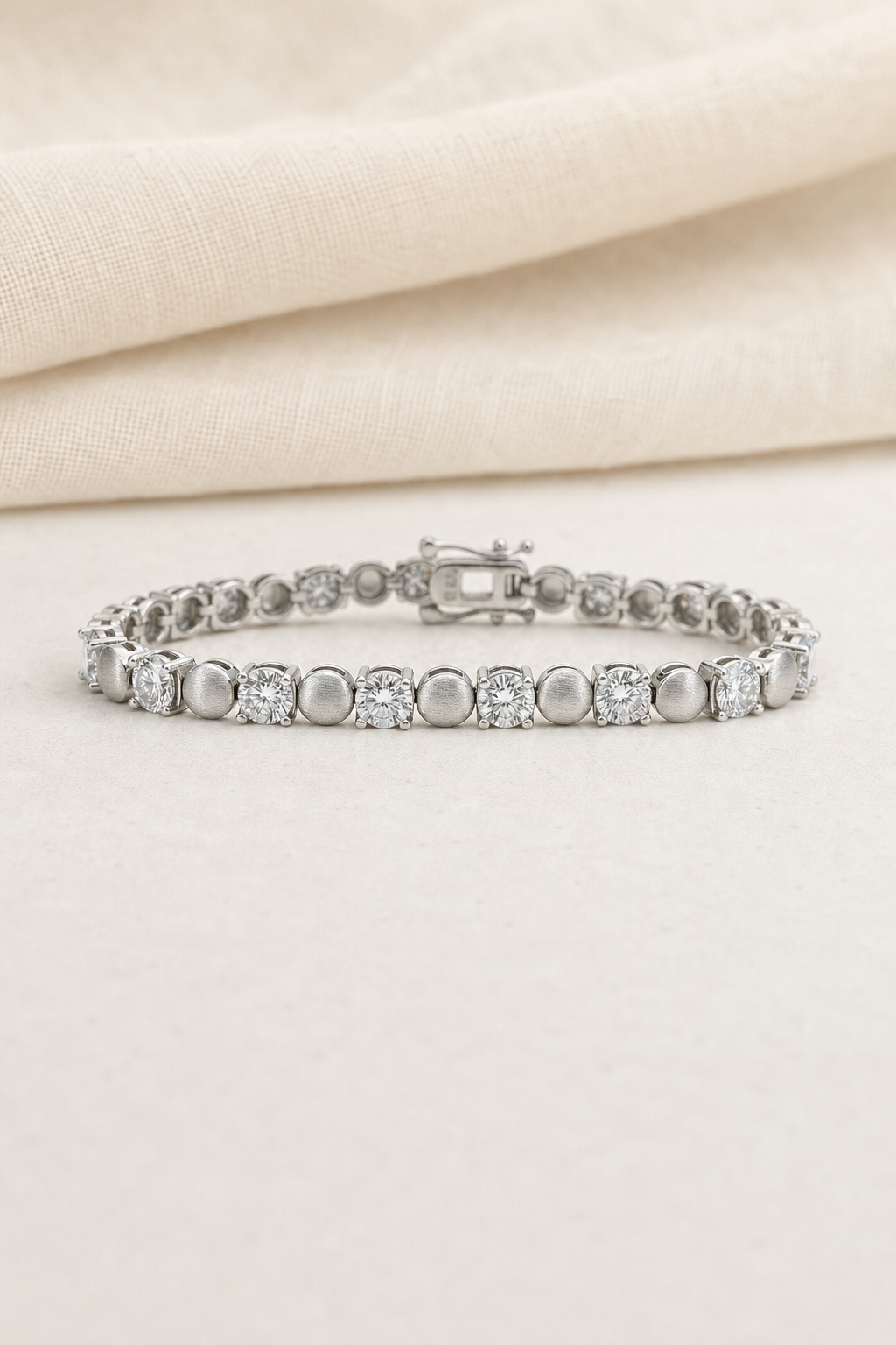 Impimo 8 CT (0.5 CT) Moissanite Round Cut Bracelet - 925 Sterling Silver with 18K White Gold Plating | display view on ivory linen