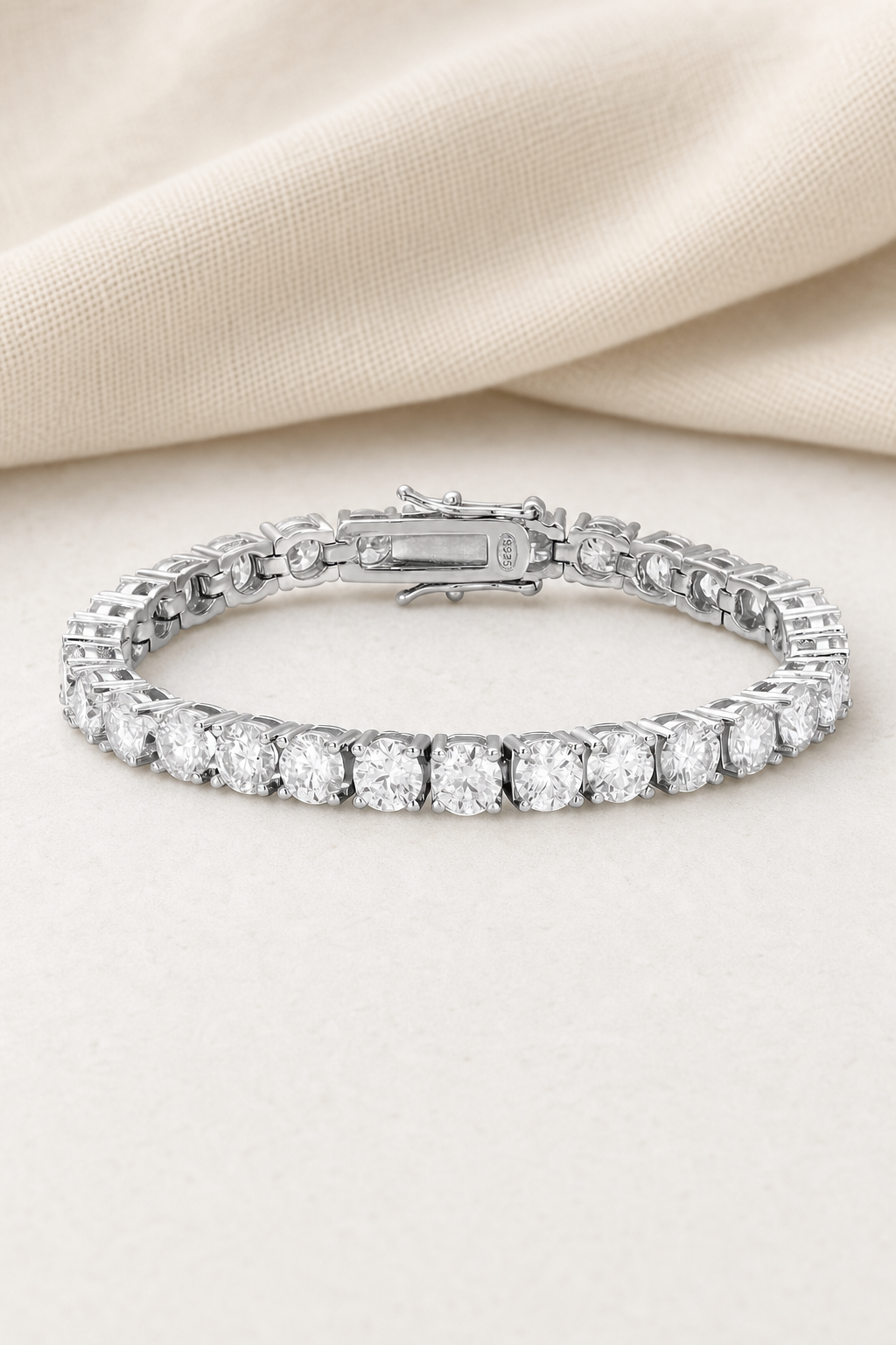 Impimo Moissanite 14 CTW Round Cut Tennis Bracelet - 925 Sterling Silver (0.50 CT Per Stone) | display view on ivory linen