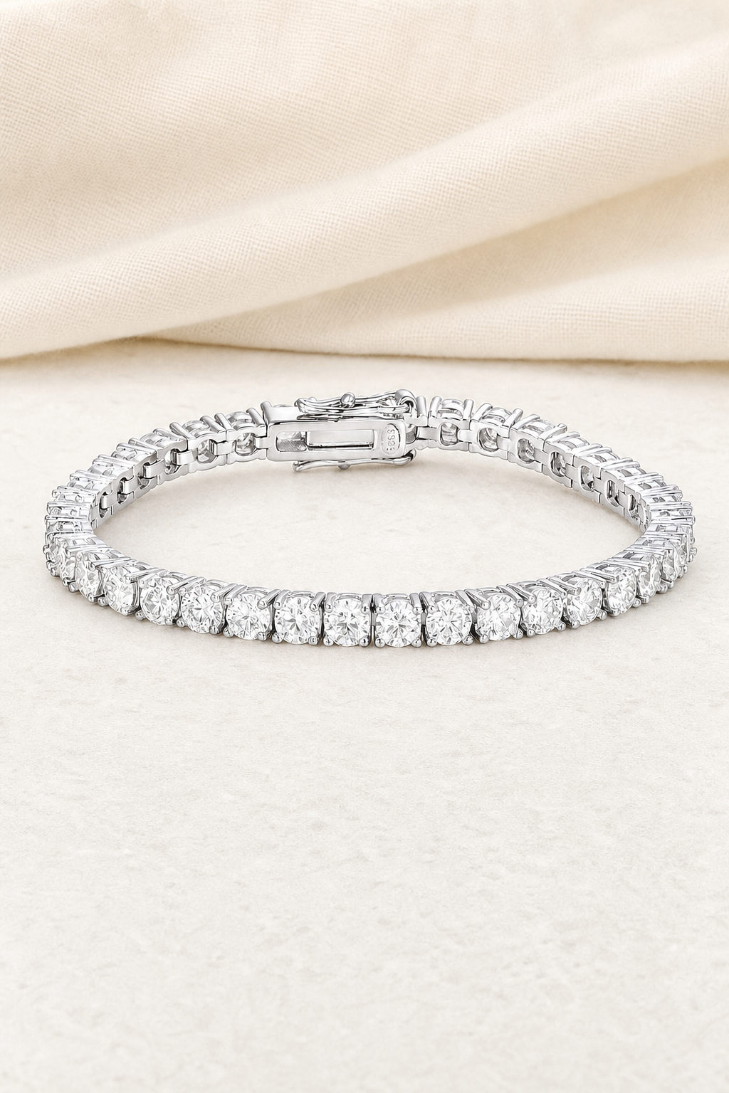 Impimo Moissanite Over 11 CT Round Cut Tennis Bracelet - 925 Sterling Silver (0.30 CT Per Stone) | display view on ivory linen