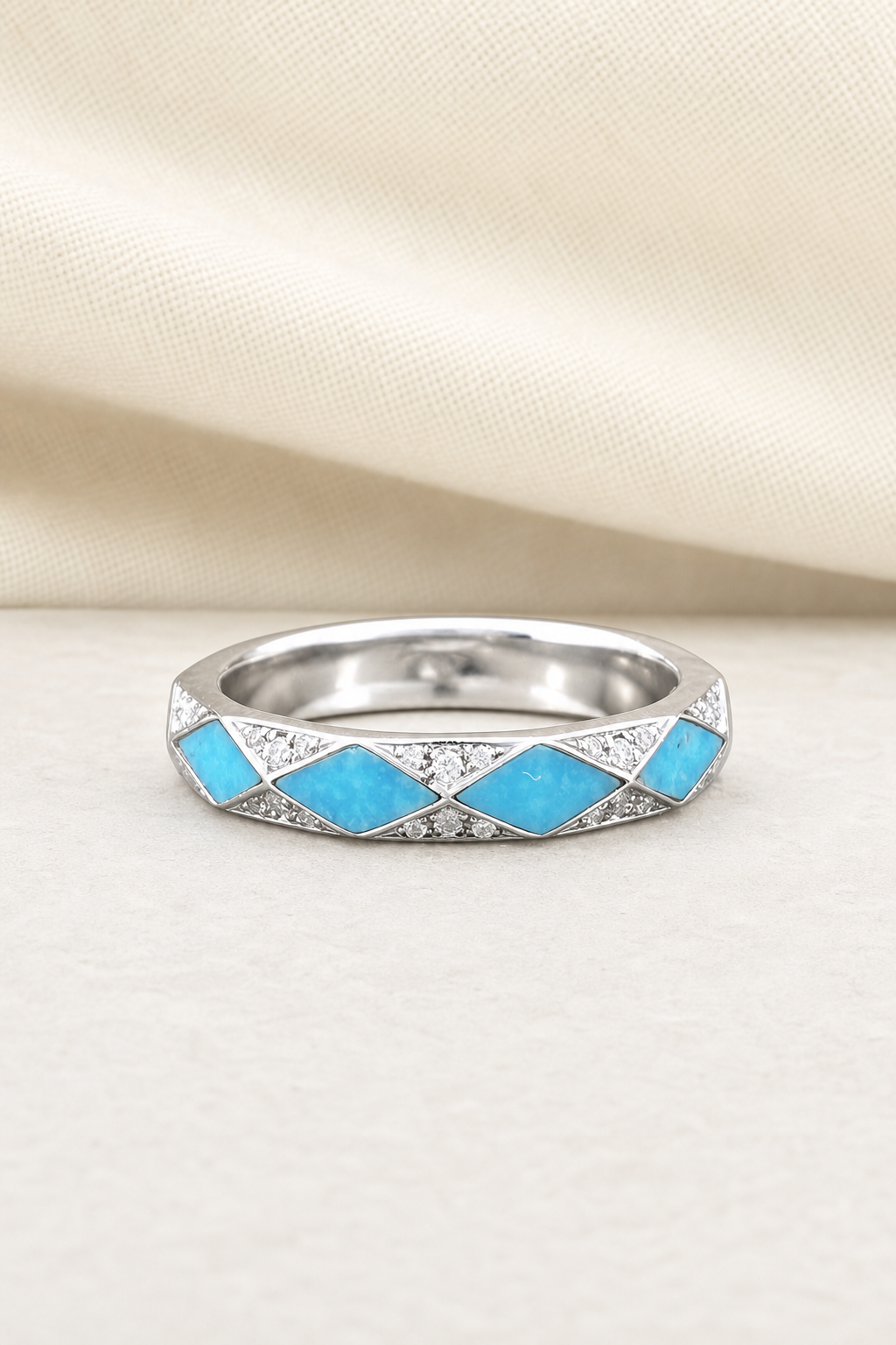 Impimo Moissanite & Natural Turquoise Geometric Ring - 925 Sterling Silver 18K White Gold | display view on ivory linen