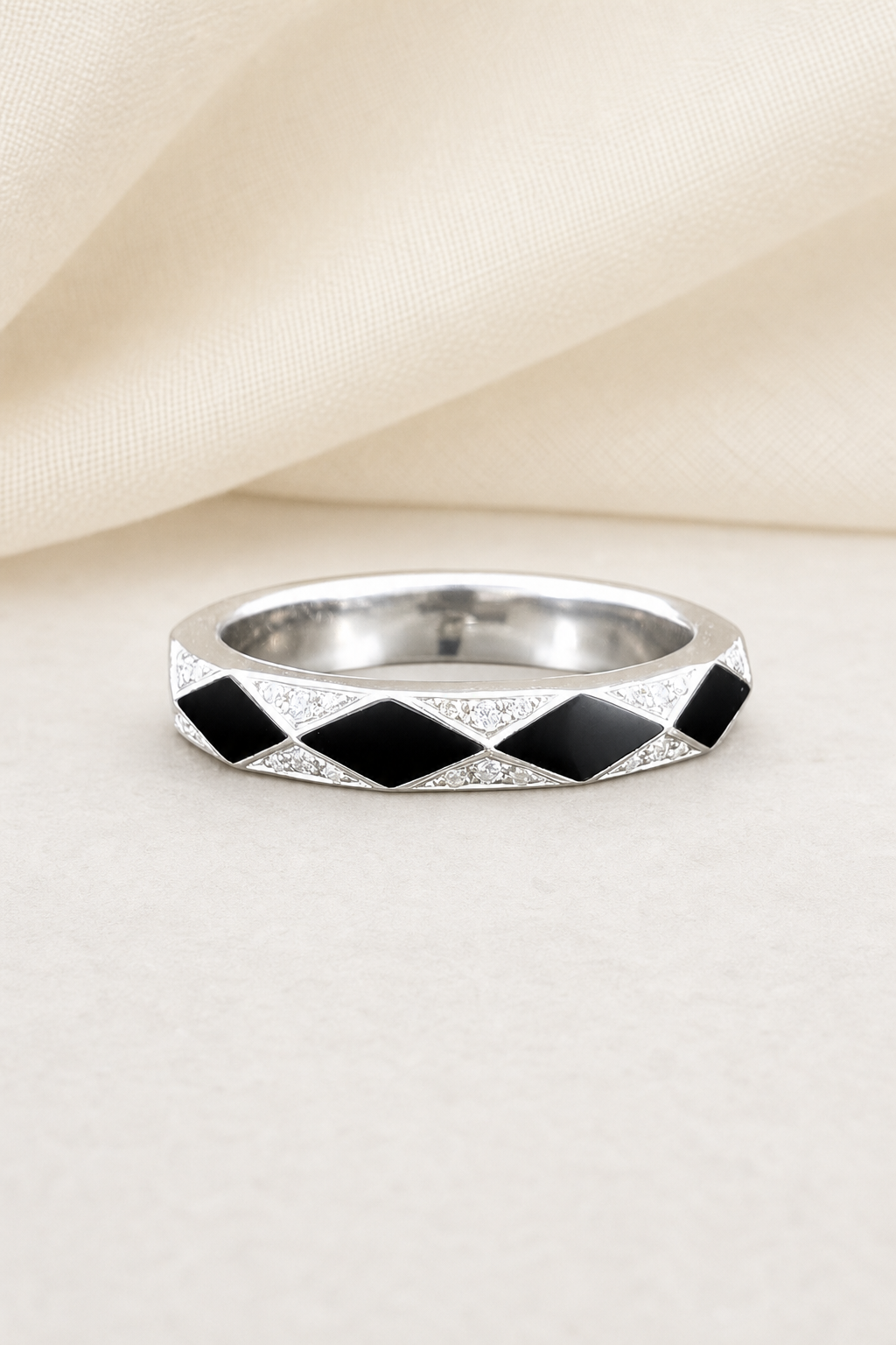 Impimo Moissanite & Black Onyx Geometric Ring - 925 Sterling Silver 18K White Gold | display view on ivory linen