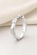 Impimo 0.35 CT Moissanite Geometric Eternity Ring - 925 Sterling Silver 18K White Gold | display view on ivory linen