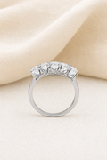 Impimo 2.5 CT (Total) Moissanite Oval Cut Ring - 925 Sterling Silver with 18K White Gold Plating | display view on ivory linen