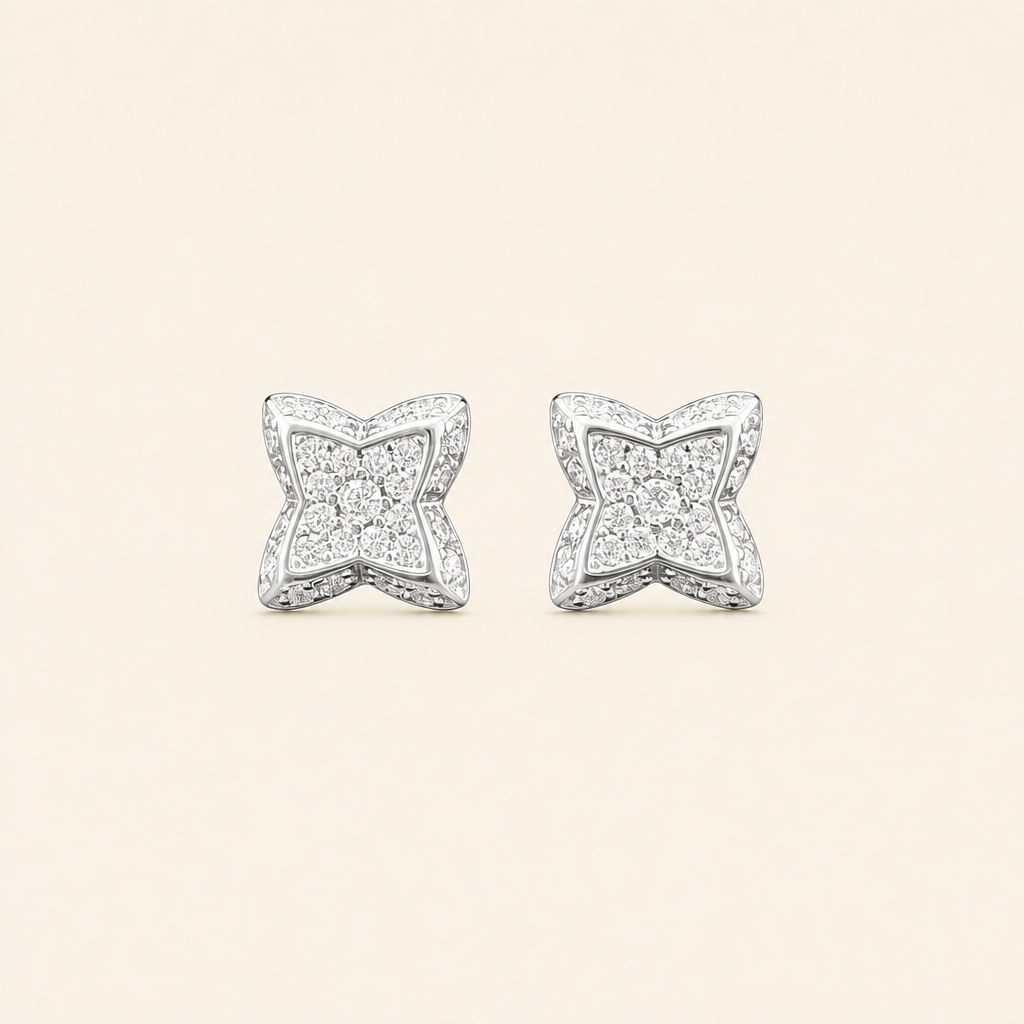 Impimo 0.3 CT (Pair) Moissanite Round Cut Earrings - Four-Point Star Pavé Stud - 925 Sterling Silver with 18K White Gold Plating | packshot on ivory