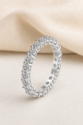 Impimo 2.2 CT (Total) Moissanite Round Cut Eternity Ring - 925 Sterling Silver with 18K White Gold Plating | display view on ivory linen