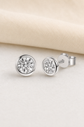 Impimo 0.6/1/2 CT Moissanite Round Cut Earrings - 925 Sterling Silver with 18K White Gold Plating | display view on ivory linen