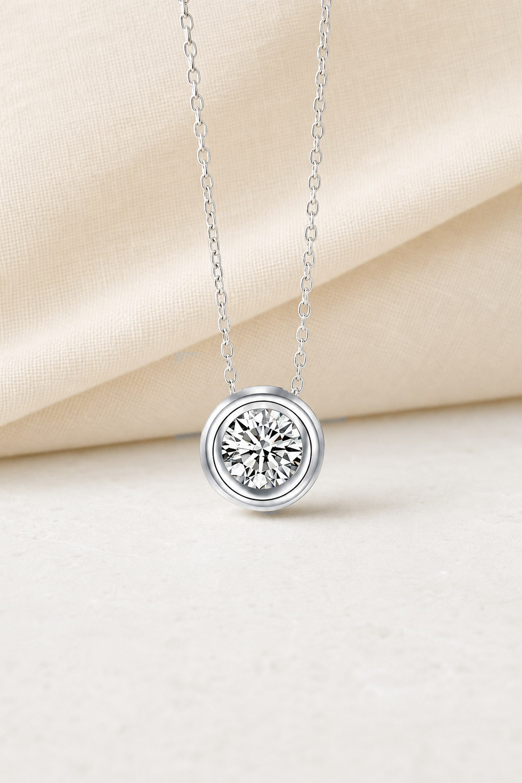 Impimo 1/2 CT Moissanite Round Cut Pendant - 925 Sterling Silver with 18K White Gold Plating | display view on ivory linen