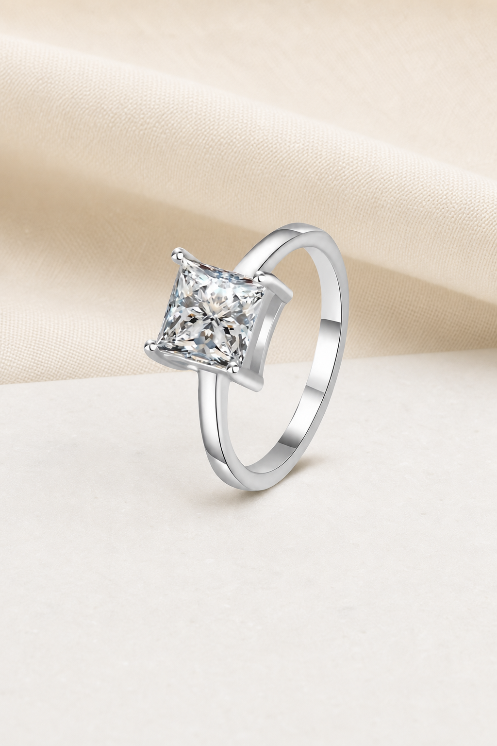 Impimo 1/2 CT Moissanite Multiple Shape Ring - 925 Sterling Silver with 18K White Gold Plating | display view on ivory linen - princess cut