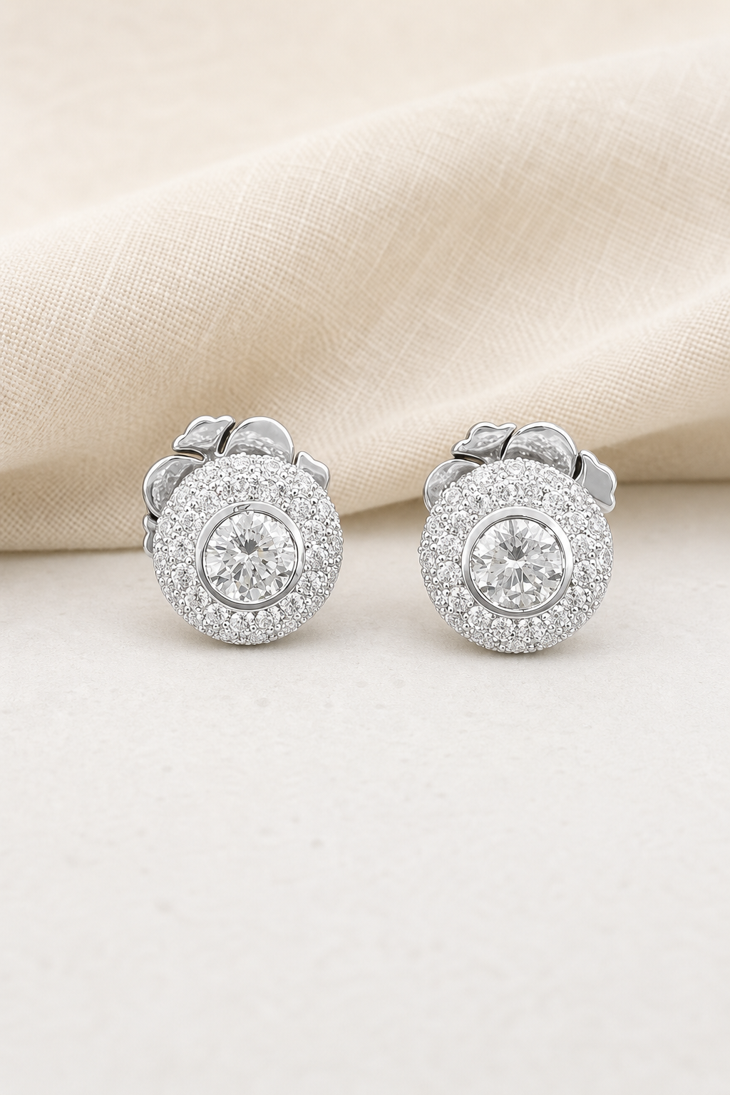 Impimo 1.6-2.6 CT Moissanite Round Stud Earrings - 925 Sterling Silver 18K White Gold | display view on ivory linen