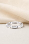 Impimo Moissanite Half Eternity Ring - 0.3 CT Total - 925 Silver 18K White Gold | display view on ivory linen