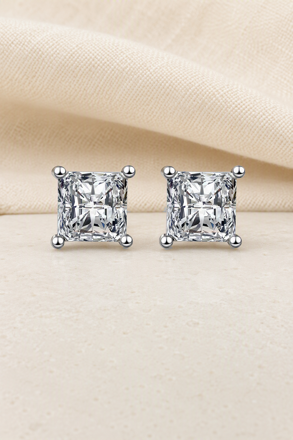 Impimo Moissanite Princess Cut Earrings - 925 Sterling Silver with 18K White Gold Plating | display view on ivory linen