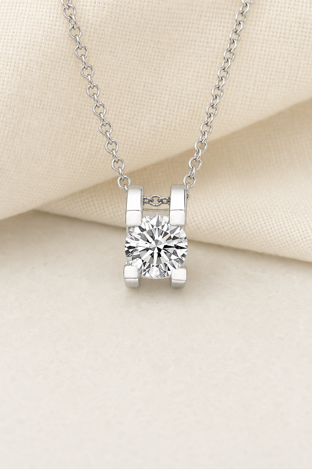 Impimo 1/2/3 CT Moissanite Round Cut Pendant - 925 Sterling Silver with 18K White Gold Plating | display view on ivory linen