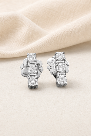 Impimo 0.7 CT (Pair) Lab-Grown Diamond Round Cut Earrings - 925 Sterling Silver with 18K White Gold Plating | display view on ivory linen