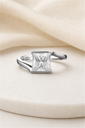 Impimo 1/2 CT Moissanite Princess Cut Ring - 925 Sterling Silver with 18K White Gold Plating | display view on ivory linen