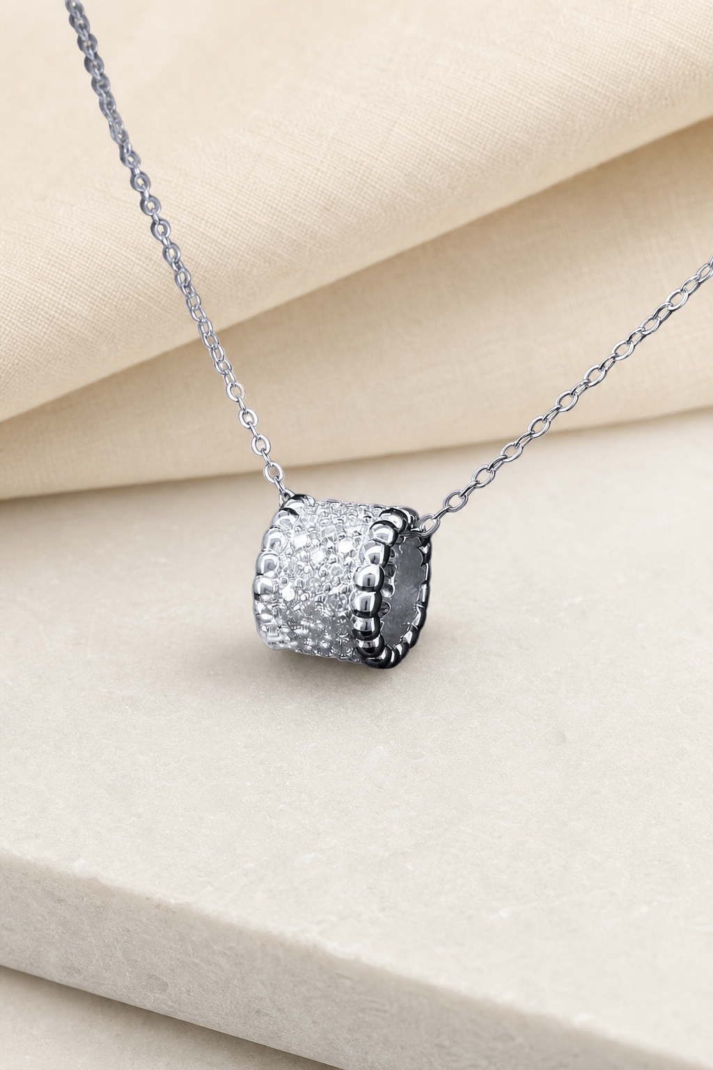 Impimo Moissanite Necklace - 0.81 CT Total - 925 Silver 18K White Gold | display view on ivory linen