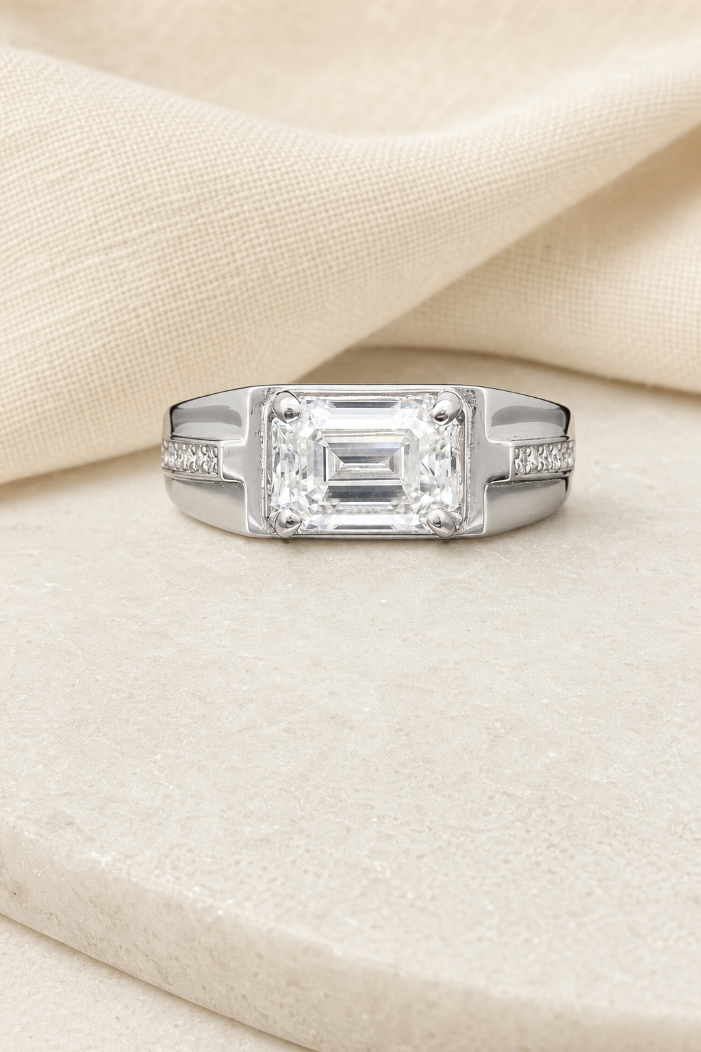 Impimo 1/2 CT Moissanite Emerald Cut Ring - 925 Sterling Silver with 18K White Gold Plating | display view on ivory linen