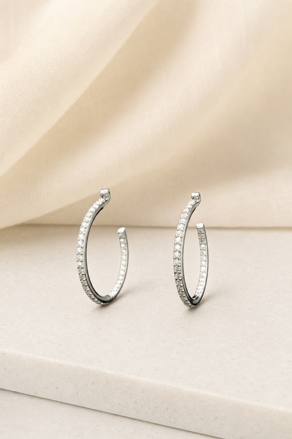 Impimo 0.6 CT Moissanite Round Cut Earrings - 925 Sterling Silver with 18K White Gold Plating | display view on ivory linen