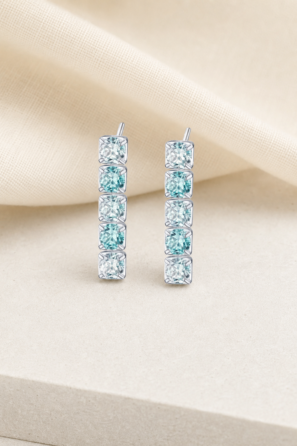Impimo 3 CT (Total) Fancy Green Moissanite Round Cut Earrings - 925 Sterling Silver with 18K White Gold Plating | display view on ivory linen