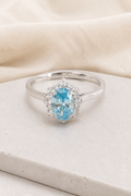 Impimo 1.27 CT Fancy Vivid Blue Lab-Grown Diamond Oval Cut Ring - 9K White Gold | display view on ivory linen