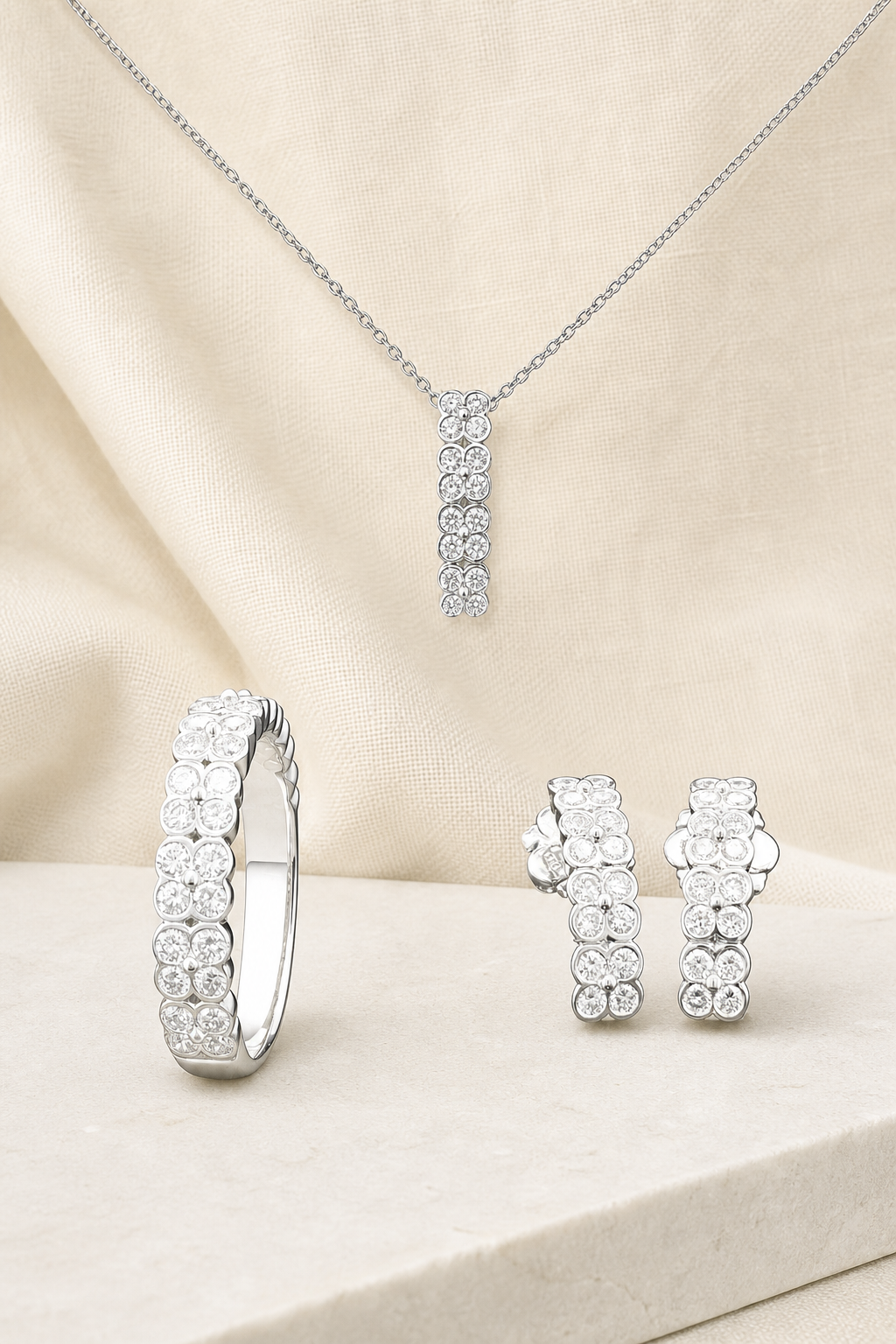 Impimo Lab-Grown Diamond Jewelry Set - Ring, Pendant & Earrings - Round Cut - 925 Sterling Silver with 18K White Gold Plating | display view on ivory linen