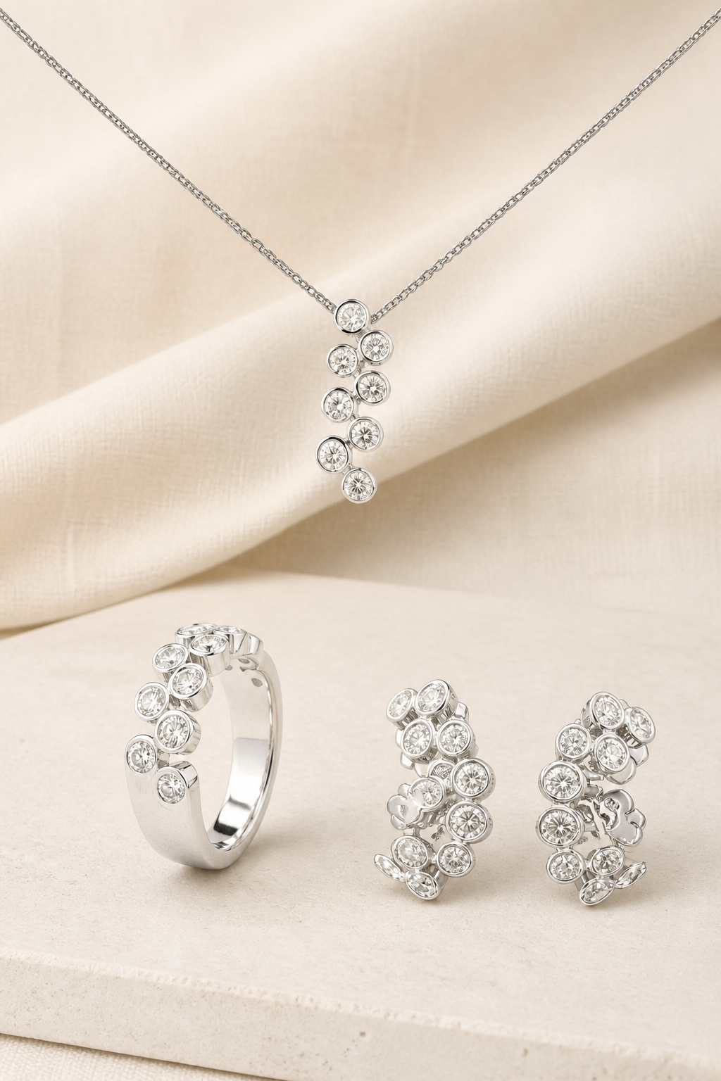 Impimo Lab-Grown Diamond Jewelry Set - Ring & Earrings - Round Cut - 925 Sterling Silver with 18K White Gold Plating | display view on ivory linen