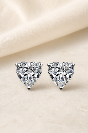 Impimo 1/2/4 CT Moissanite Heart Cut Earrings - 925 Sterling Silver with 18K White Gold Plating | display view on ivory linen