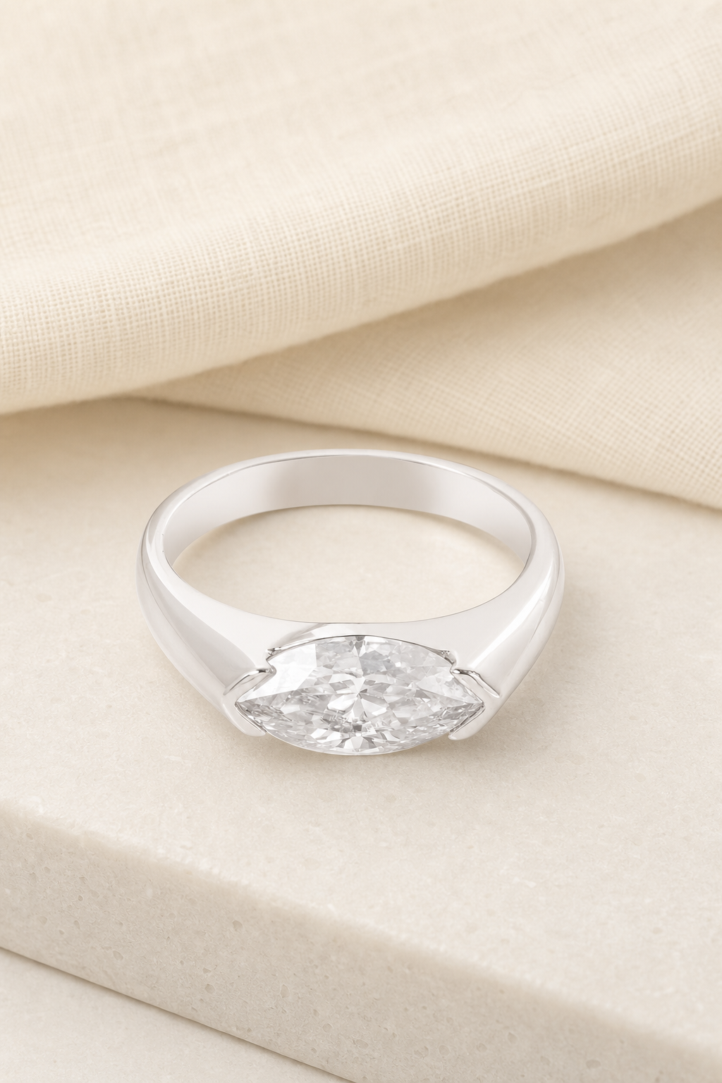 Impimo 1/2 CT Moissanite Marquise Cut Ring - 925 Sterling Silver with 18K White Gold Plating | display view on ivory linen