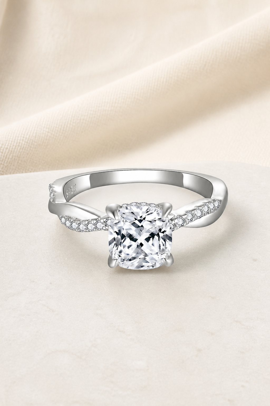 Impimo 2 CT Moissanite Multiple Shape Ring - 925 Sterling Silver with 18K White Gold Plating | display view on ivory linen - cushion cut