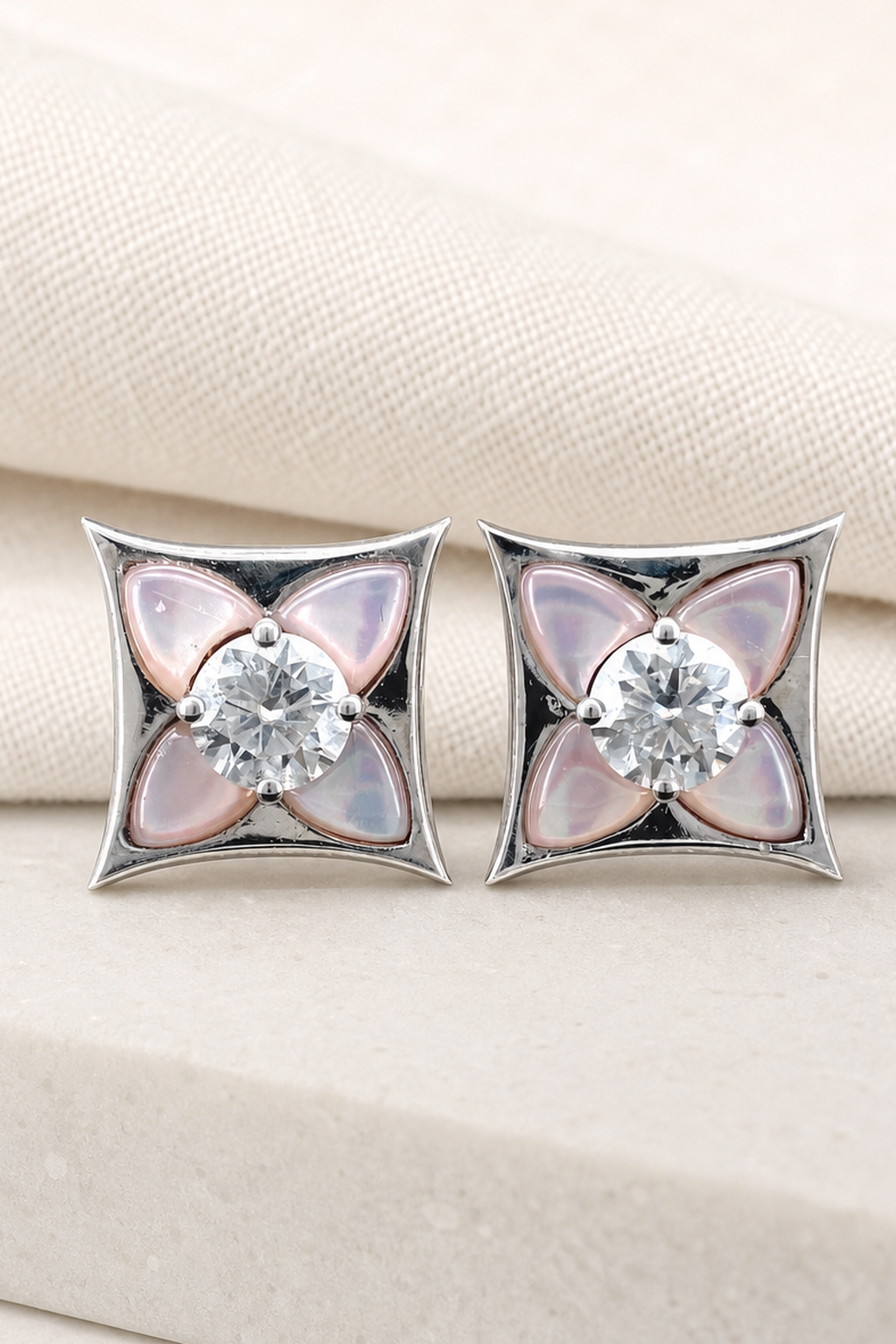 Impimo Natural Pink Mother of Pearl & Moissanite Four-Point Star Stud Earrings - 925 Sterling Silver with 18K White Gold Plating | close-up detail of the setting