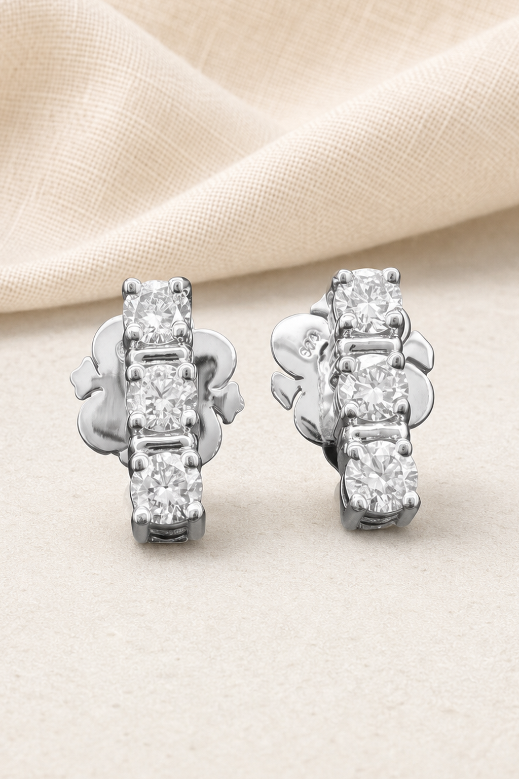 Impimo 0.7 CT (Pair) Lab-Grown Diamond Round Cut Earrings - 925 Sterling Silver with 18K White Gold Plating | close-up detail of the setting