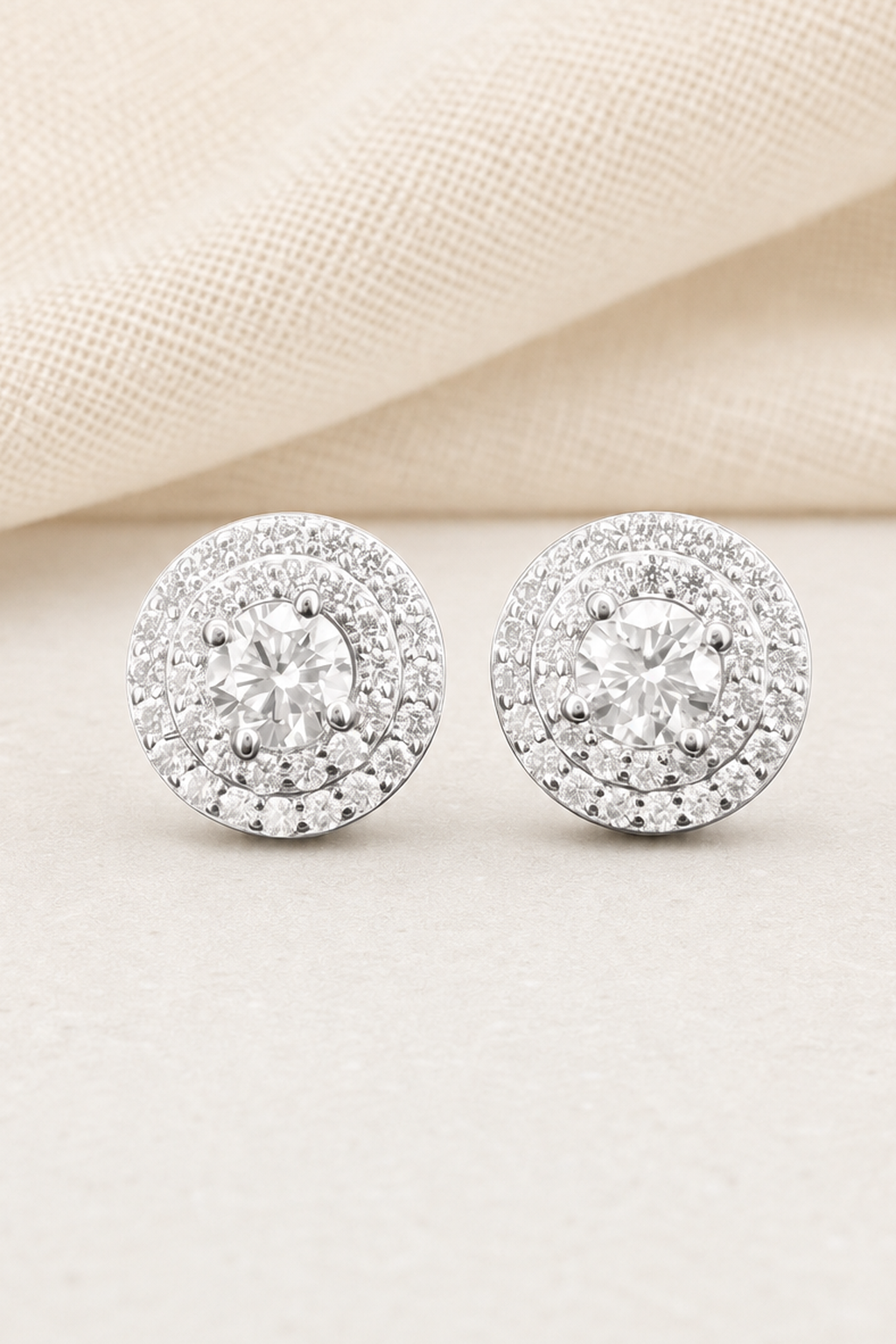 Impimo 0.55/1 CT (Pair) Moissanite Round Cut Earrings - 925 Sterling Silver with 18K White Gold Plating | close-up detail of the setting