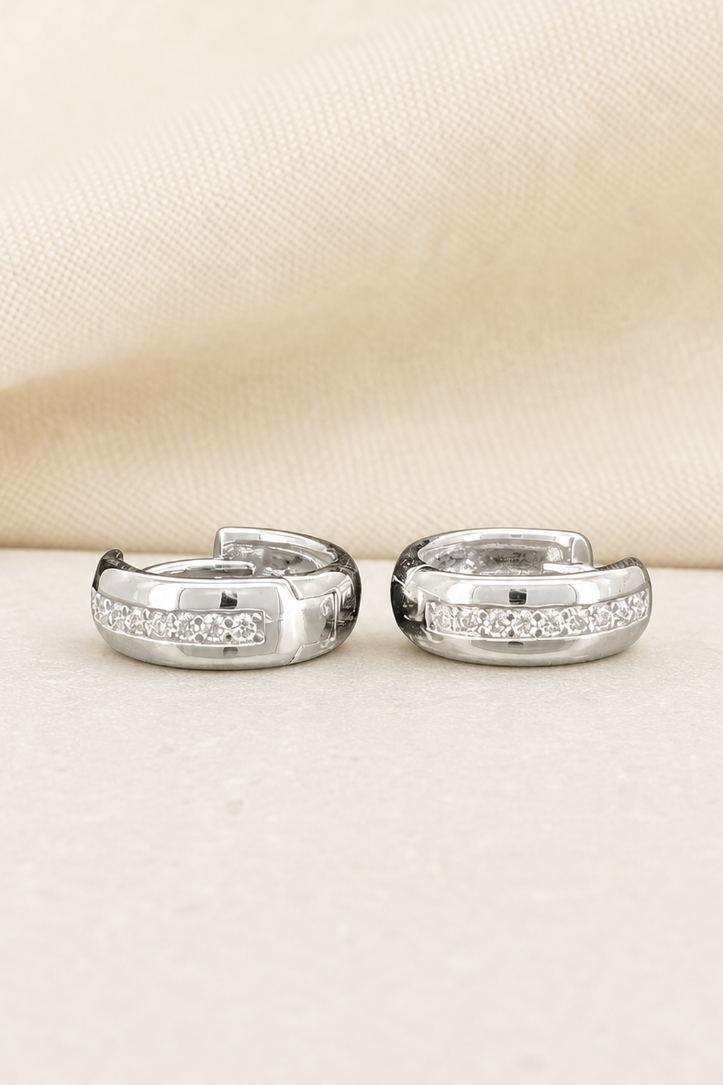 Impimo 0.2 CT (Pair) Moissanite Round Cut Earrings - 925 Sterling Silver with 18K White Gold Plating | close-up detail of the setting