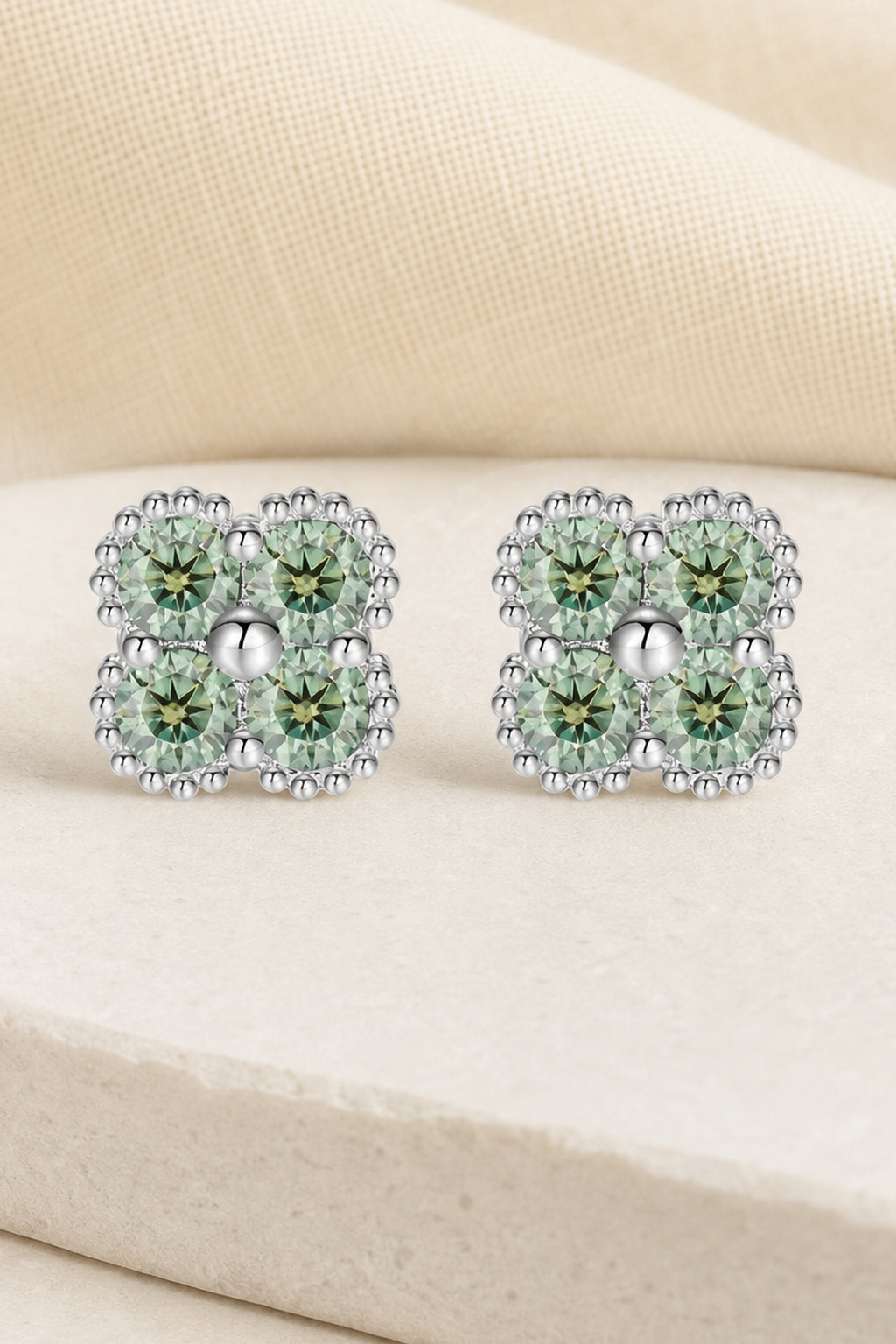 Impimo Fancy Green Moissanite Four-Leaf Clover Jewelry Set - Pendant, Bracelet & Earrings | close-up detail of the setting