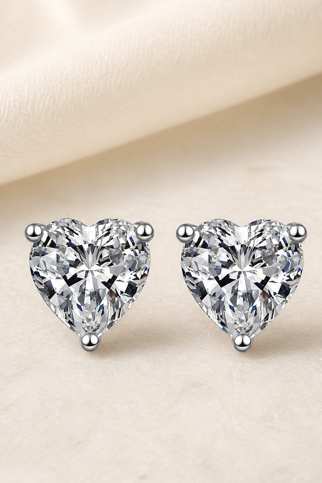 Impimo 1/2/4 CT Moissanite Heart Cut Earrings - 925 Sterling Silver with 18K White Gold Plating | close-up detail of the setting