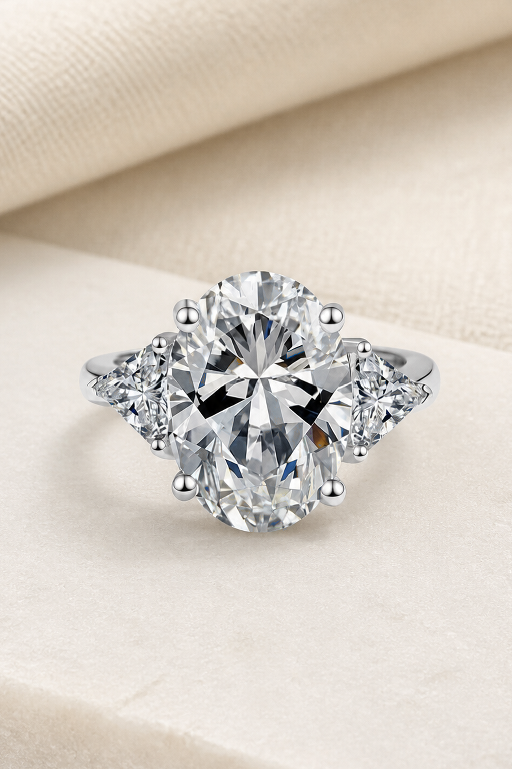Impimo 8 CT Moissanite Oval Cut Ring - Three-Stone with 0.50 CT Trillion Sides - 925 Sterling Silver with 18K White Gold Plating | close-up detail of the setting