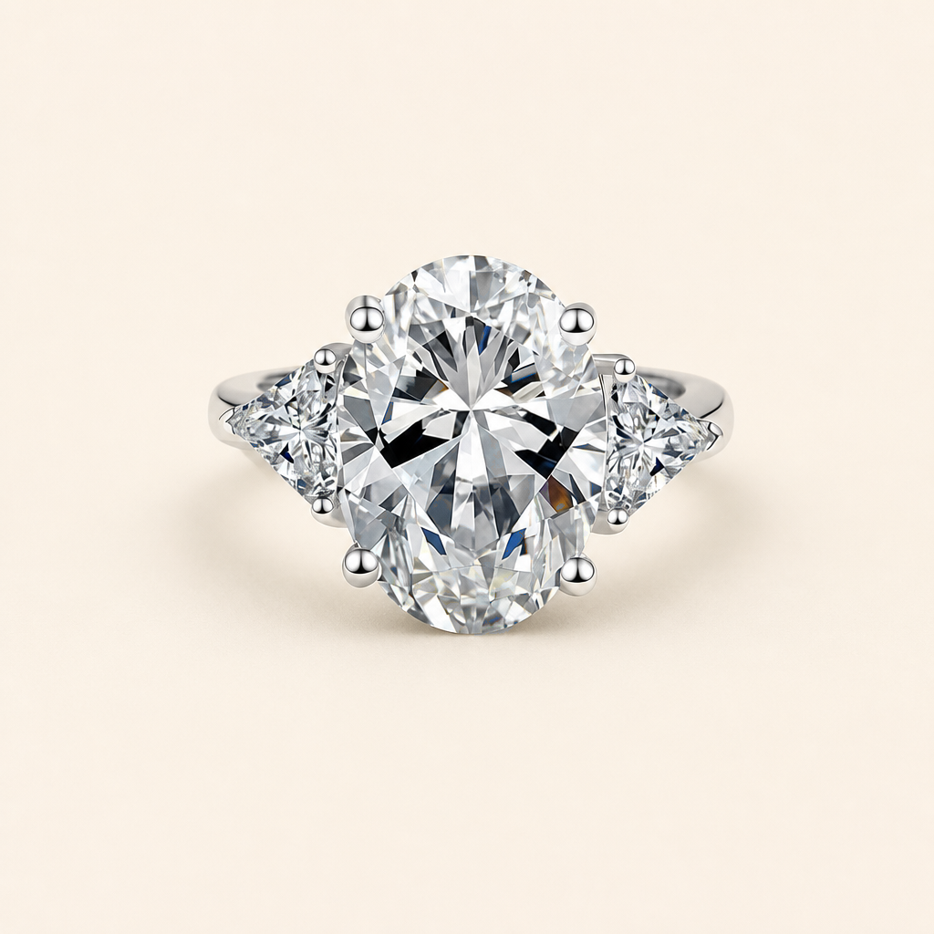 Impimo 8 CT Moissanite Oval Cut Ring - Three-Stone with 0.50 CT Trillion Sides - 925 Sterling Silver with 18K White Gold Plating | packshot on ivory