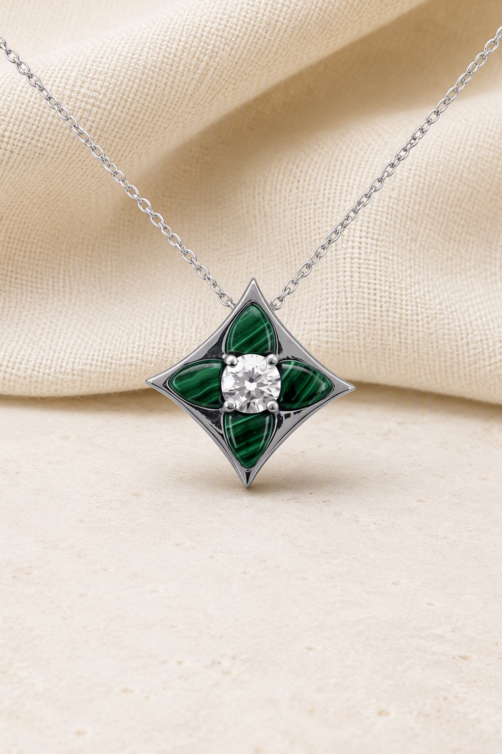 Impimo Natural Malachite & Moissanite Pendant - Four-Point Star - 925 Sterling Silver with 18K White Gold Plating | close-up detail of the setting