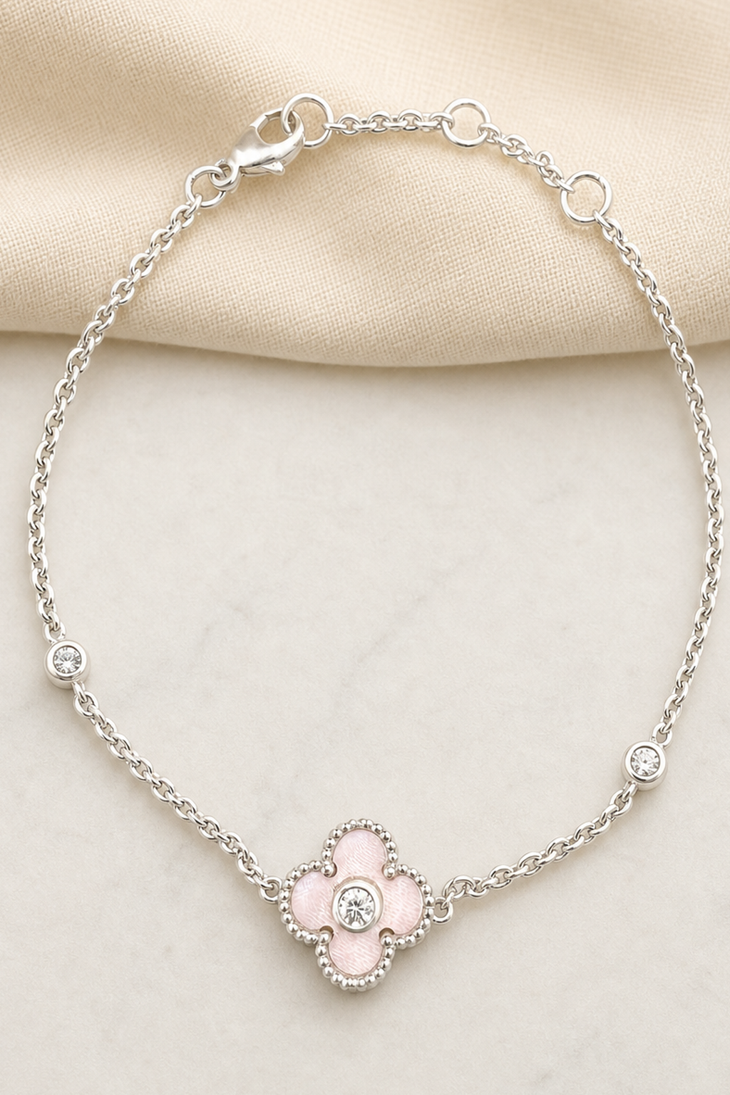 Impimo Natural Pink Mother of Pearl & Moissanite Four-Leaf Clover Bracelet - 925 Sterling Silver with 18K White Gold Plating | close-up detail of the setting