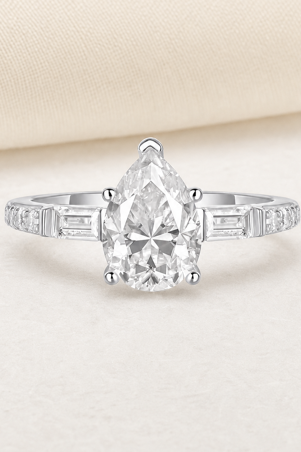 Impimo Moissanite 1.5 CT Pear Cut Ring - 925 Sterling Silver with 18K White Gold Plating | close-up detail of the setting