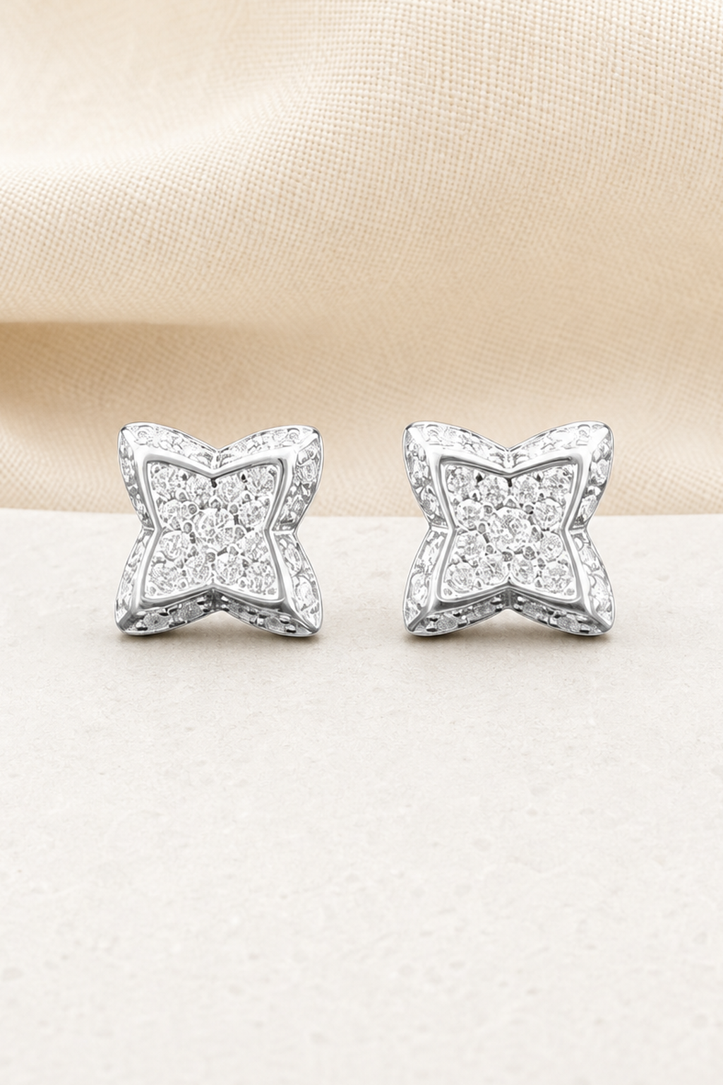 Impimo 0.3 CT (Pair) Moissanite Round Cut Earrings - Four-Point Star Pavé Stud - 925 Sterling Silver with 18K White Gold Plating | close-up detail of the setting